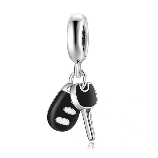 Silver car key charm.