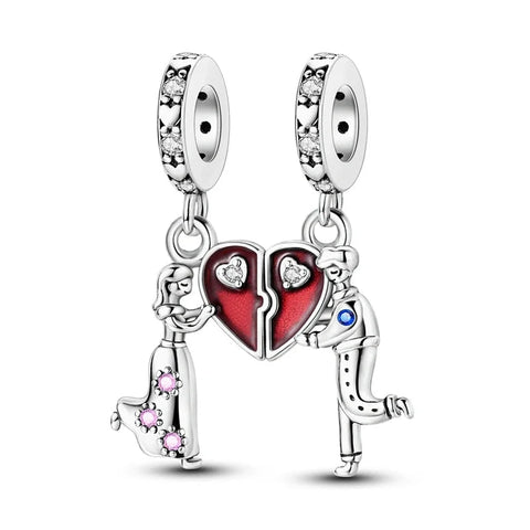 Silver charm with a heart design featuring two people and colorful stones on a white background
