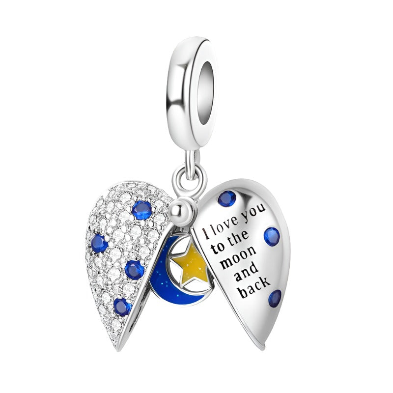 Sterling silver heart charm with "I Love You to the Moon and Back" message and blue crystals.