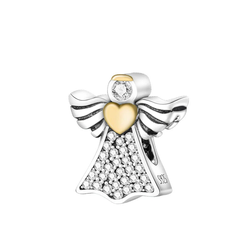 Sterling silver angel charm with gold heart and crystals.