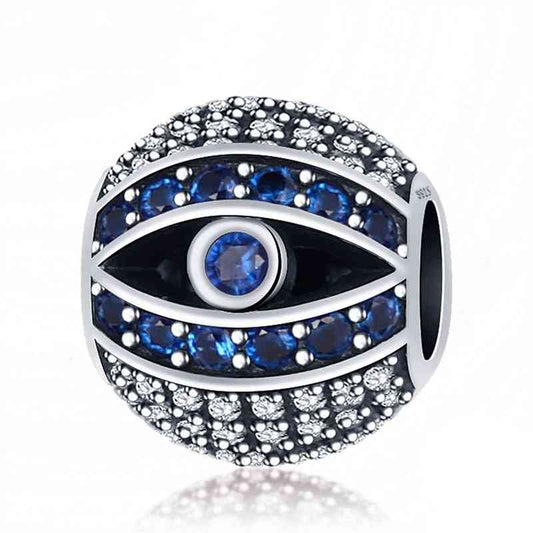 Sterling silver evil eye charm with blue and white crystals.