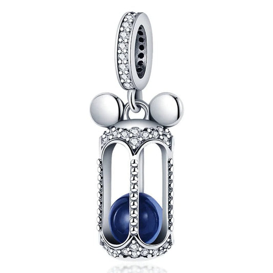 Sterling silver hourglass dangle charm with blue enamel and cubic zirconia accents.