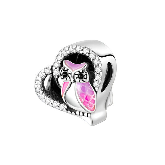 Sterling silver heart owl charm with pink enamel and cubic zirconia accents.