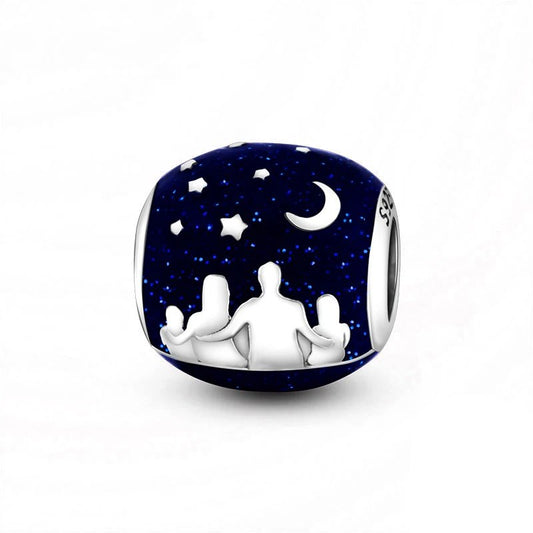 Sterling silver night sky charm with dark blue enamel and star details.