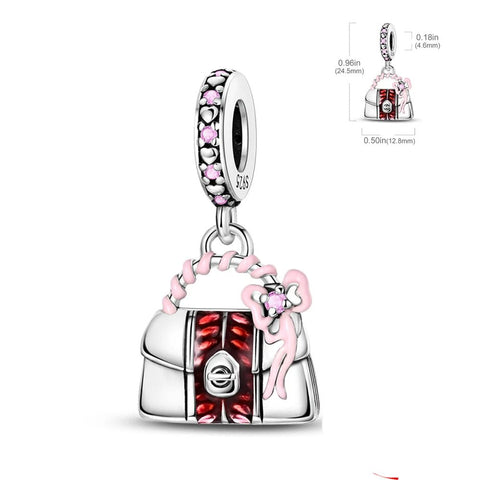 Charming red purse charm with pink bow accent