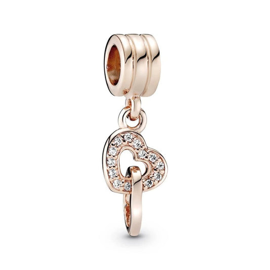 Rose gold heart dangle charm with crystals, perfect for charm bracelets or necklaces.