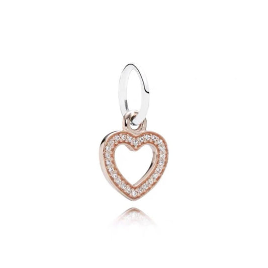 Rose gold heart charm with crystal accents, perfect for charm bracelets or necklaces.