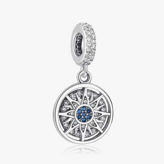 Sterling silver starburst charm with blue and clear crystals