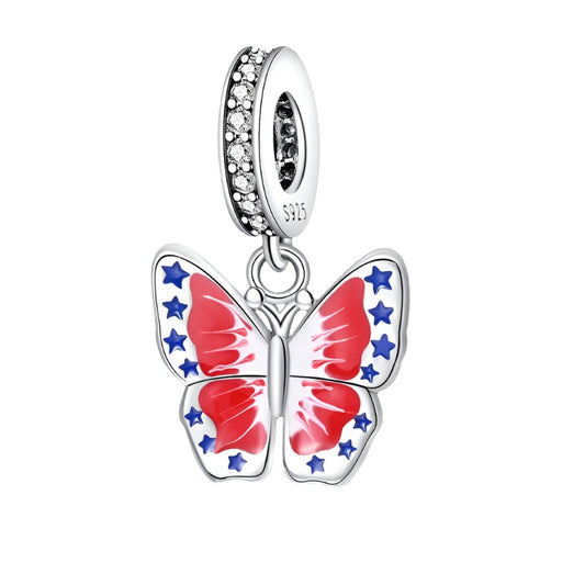 Patriotic butterfly charm with wings in red, white, and blue, adorned with stars.