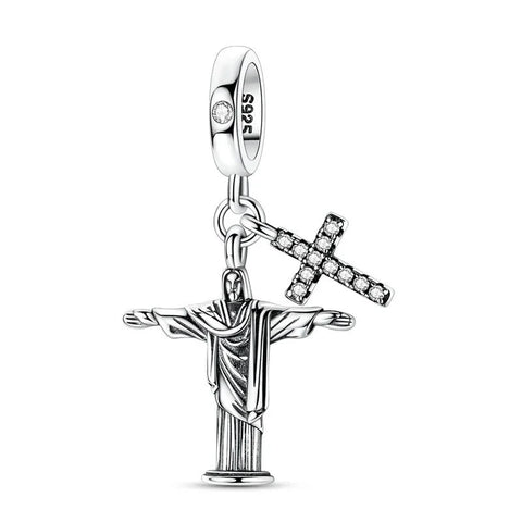 Christ the Redeemer & Crystal Cross Dangle Charm - A sterling silver dangle charm featuring the Christ the Redeemer statue with outstretched arms and a separate crystal-studded cross pendant, both hanging from a S925-stamped clip bail