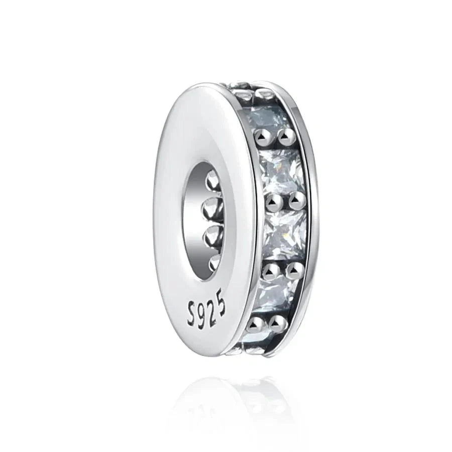 Sterling silver spacer charm with a row of clear cubic zirconia stones for added sparkle and balance.