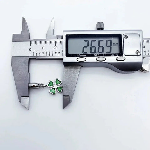 Clover pendant measured by digital calipers.