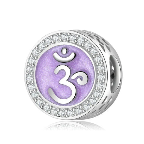 Silver charm with purple Om symbol.