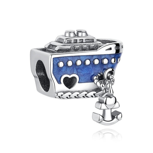 Silver-tone cruise ship charm with blue enamel hull, porthole details, heart cutout, rope border, and a small dangling anchor charm