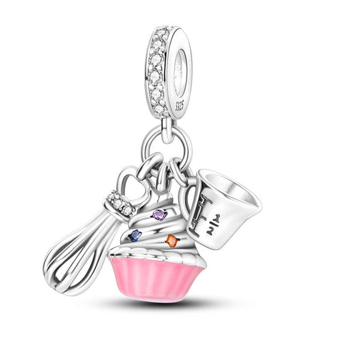 Silver cupcake and whisk charm with pink enamel and crystals.