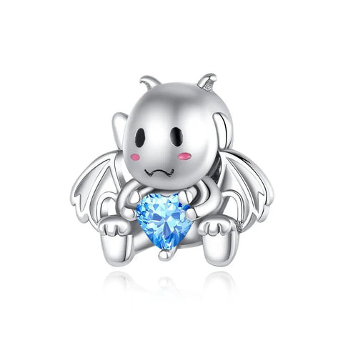 Cute Dragon Charm Holding Blue Heart Gem in Sterling Silver - Cute sterling silver dragon charm holding a blue heart-shaped gemstone, ideal for charm bracelets or necklaces.