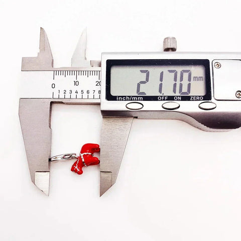 Red and white boxing glove ring being measured.