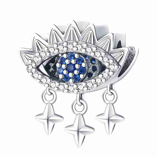 Sterling silver dangling evil eye charm with blue and white crystals and three star accents for charm bracelets.