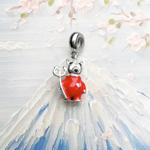 Red devil pig charm.