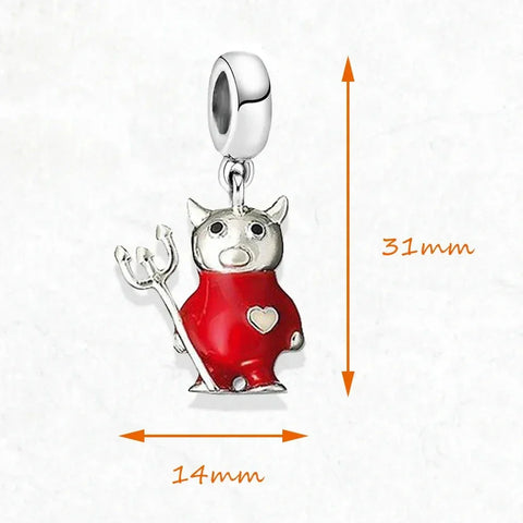 Devil-shaped charm with red enamel and silver details.