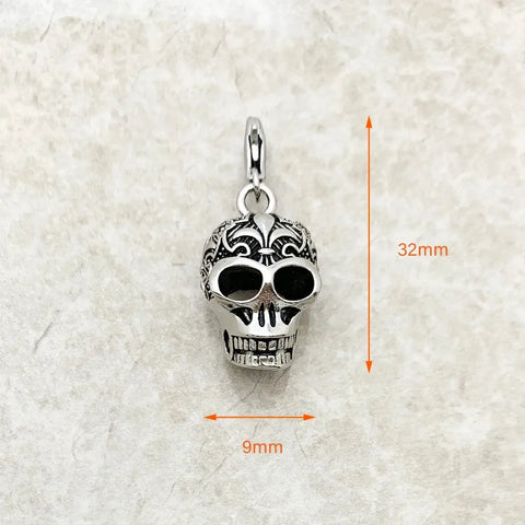 Silver skull pendant with dimensions.