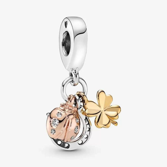 Lucky Charm with Clover, Horseshoe, and Ladybug - Silver lucky charm bracelet featuband a clover, horseshoe, and ladybug, accented with gold.