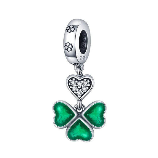 Sterling silver four-leaf clover charm with green enamel and heart.