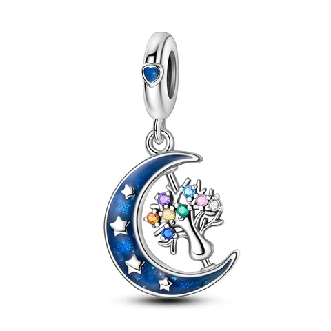 Enchanted Moon and Tree Sterling Silver Charm with Enamel - Sterling silver charm with a blue crystal held by a dragon claw.