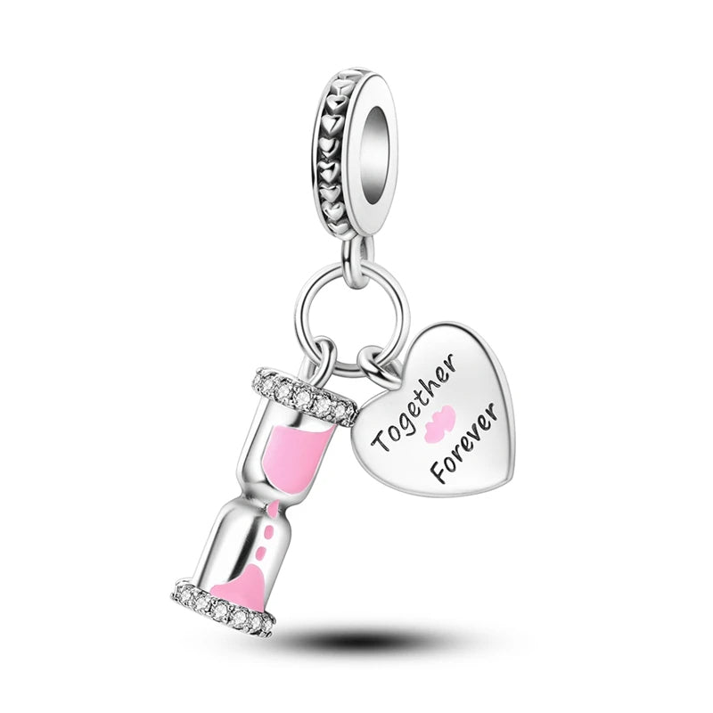 Sterling silver hourglass charm with pink enamel and heart pendant, fits Pandora bracelet.