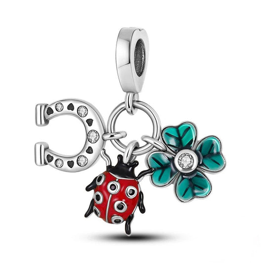 Silver lucky ladybug charm with horseshoe and four-leaf clover, accented with colorful enamel.