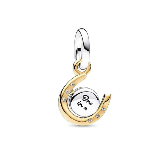 Gold horseshoe charm with an inspirational quote, ideal for adding positivity.