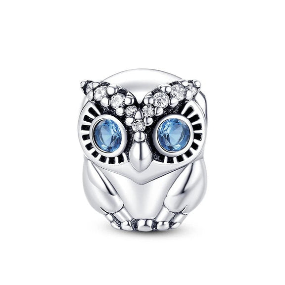 Sterling Silver Owl Charm with Blue Eyes and Crystal Accents - Sterling silver owl charm with blue eyes and crystal accents.