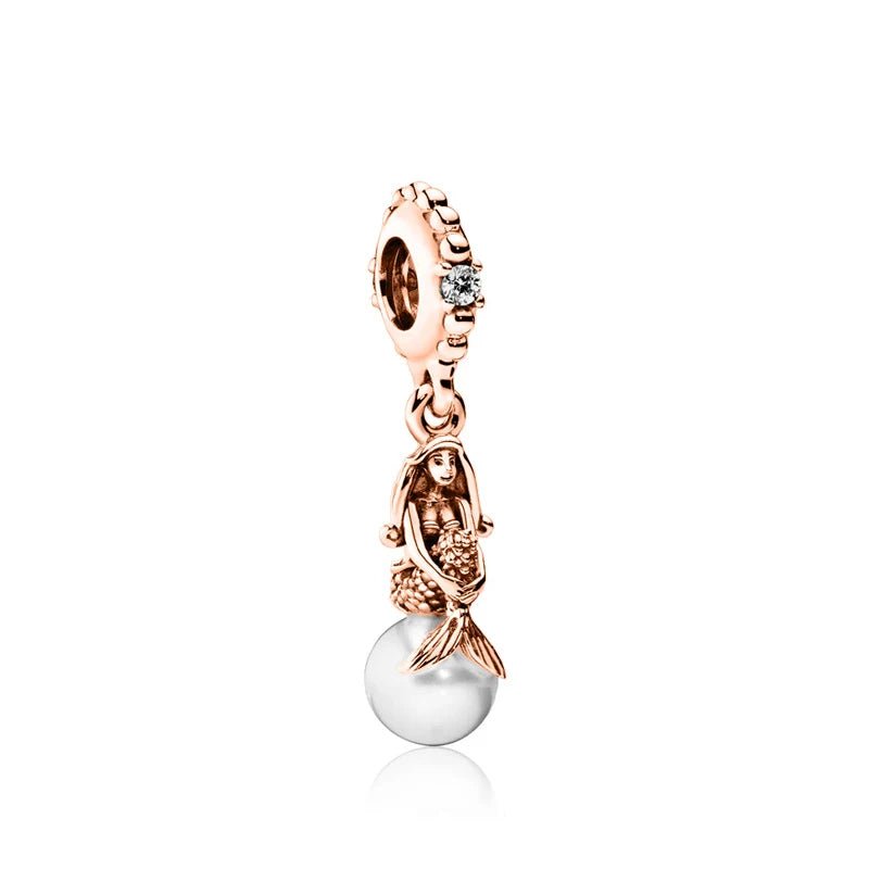 Rose gold mermaid charm holding a pearl, ideal for charm bracelets or necklaces.