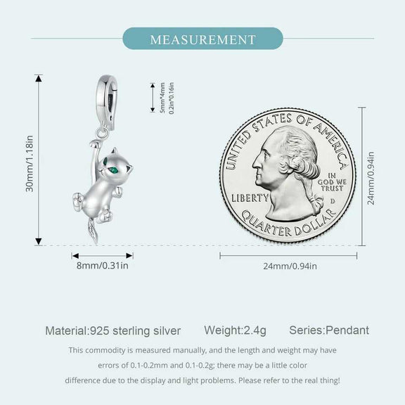 Sterling Silver Hanging Cat Charm with Emerald Eyes - Measurement details of a sterling silver hanging cat charm with a quarter coin for size reference, showing a height of 30mm and a width of 8mm.