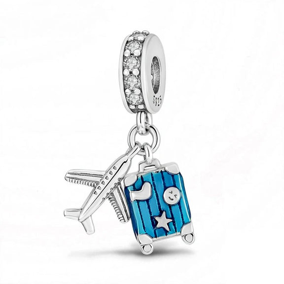 Travel Themed Charm with Blue Suitcase and Airplane in Sterling Silver - Sterling silver travel-themed charm with blue suitcase and airplane, adorned with zircon stones.