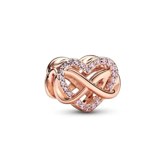 Rose gold heart charm with intertwined design and crystals