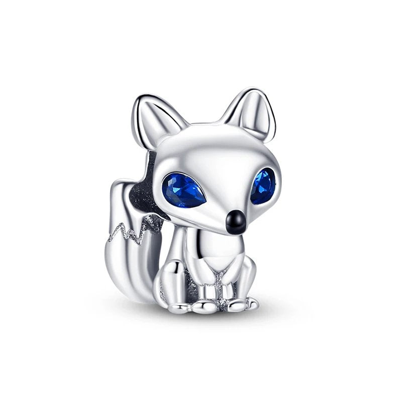 Sterling silver fox charm with blue crystal eyes.