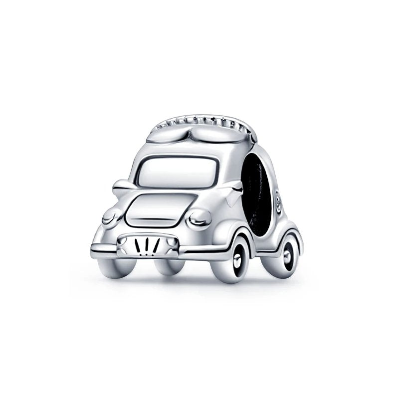 Sterling silver car charm with detailed design.