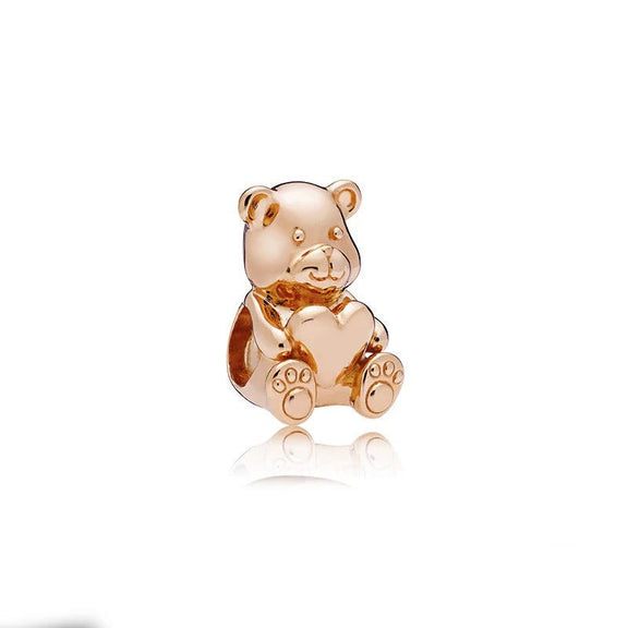 Adorable Rose Gold Bear Charm Holding Heart - Rose gold bear charm holding a heart, perfect for charm bracelets or necklaces.