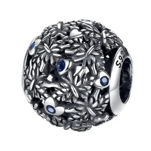 Sterling silver round dragonfly charm with intricate blue accents, perfect for nature lovers.