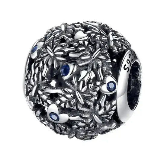 Sterling silver round dragonfly charm with intricate blue accents, perfect for nature lovers.