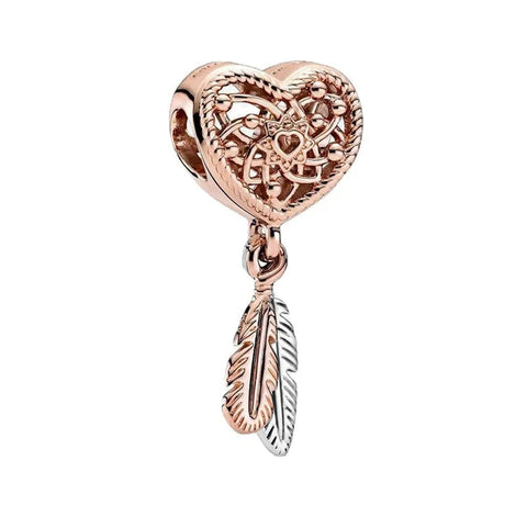 Dreamcatcher Charm with Feather Dangle in Rose Gold - Dreamcatcher charm in rose gold with a detailed feather dangle.