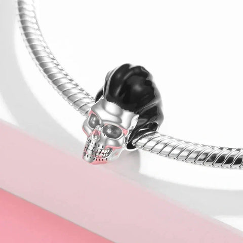 Silver skull charm with black hair.