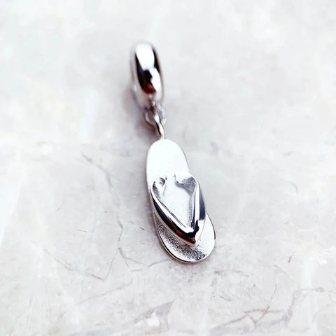 Silver flip-flop charm.