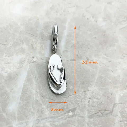 Silver flip-flop charm.