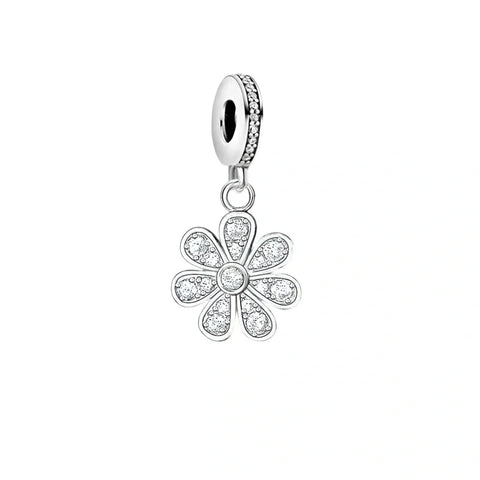 Silver flower charm with embedded crystals.