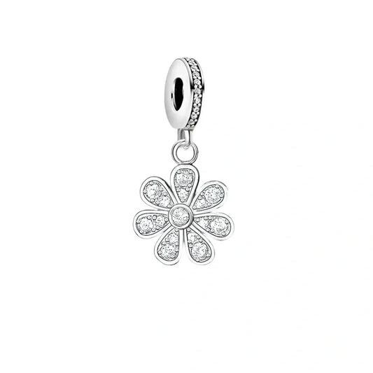 Silver flower charm with embedded crystals.