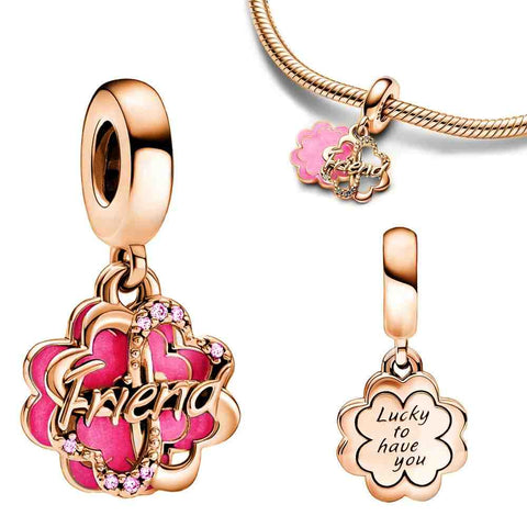 Friend Flower Charm in rose gold with pink enamel petals and crystal accents. Engraved with "Friend" and "Lucky to have you." Perfect for celebrating friendships.