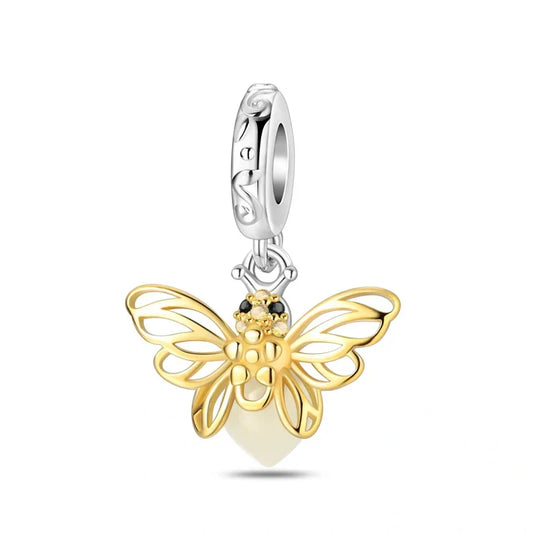 Sterling silver and gold-plated butterfly charm with intricate wing details and sparkling accents, symbolizing transformation and beauty.