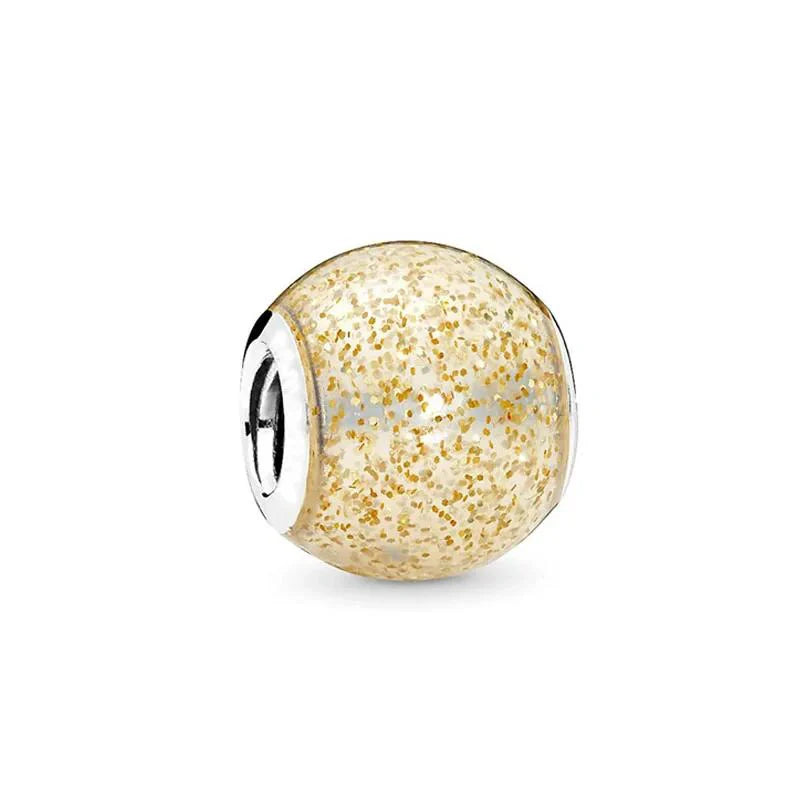 Sterling silver charm with clear enamel and golden glitter accents for a warm and sparkling look.